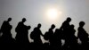 Venezuelans cross illegally into Colombia near the Simon Bolivar International Bridge, which Venezuelan authorities continue to keep closed, in La Parada near Cucuta.