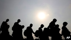 FILE - Venezuelans cross illegally into Colombia in La Parada near Cucuta, March 5, 2019.