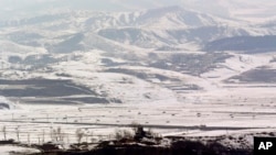 A North Korean military guard post in Kaepoong is viewed from the unification observation post near the border village of Panmunjom, north of Seoul, South Korea, February 13, 2013.