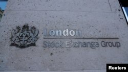 FILE - Signage is seen outside the entrance of the London Stock Exchange in London, Britain. Aug 23, 2018. 