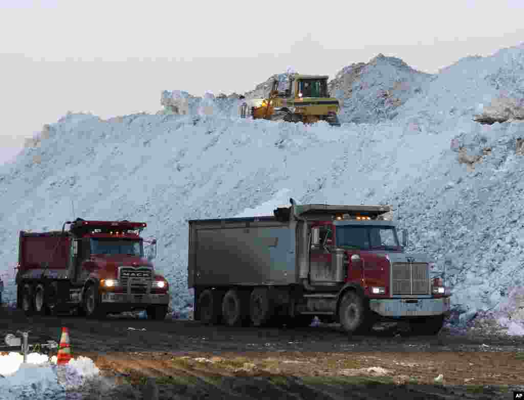 Dump trucks wait to unload snow removed from neighborhoods after heavy lake-effect snowstorms&nbsp;at the Central Terminal in Buffalo, New York. A snowfall that brought huge drifts and closed roads finally ended Friday.