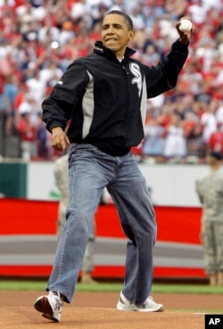 President Obama wears jean as he throws out the first pitch.