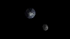 FILE - The passage of asteroid 2012 DA14 through the Earth-moon system in February 2013 is depicted in this handout image from NASA. This asteroid, at 150 feet in diameter, was puny compared with the visitor we're about to get: Asteroid 2014 JO25 is about 2,100 feet in diameter, but there's no chance of a collision with us.