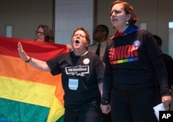 Protesters objecting to the adoption of the Traditional Plan gather and protest outside the United Methodist Church's 2019 Special Session of the General Conference in St. Louis, Mo., Feb. 26, 2019.