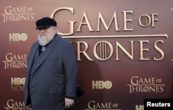 FILE - Co-executive producer George R.R. Martin arrives for the season premiere of HBO's "Game of Thrones" in San Francisco, California.