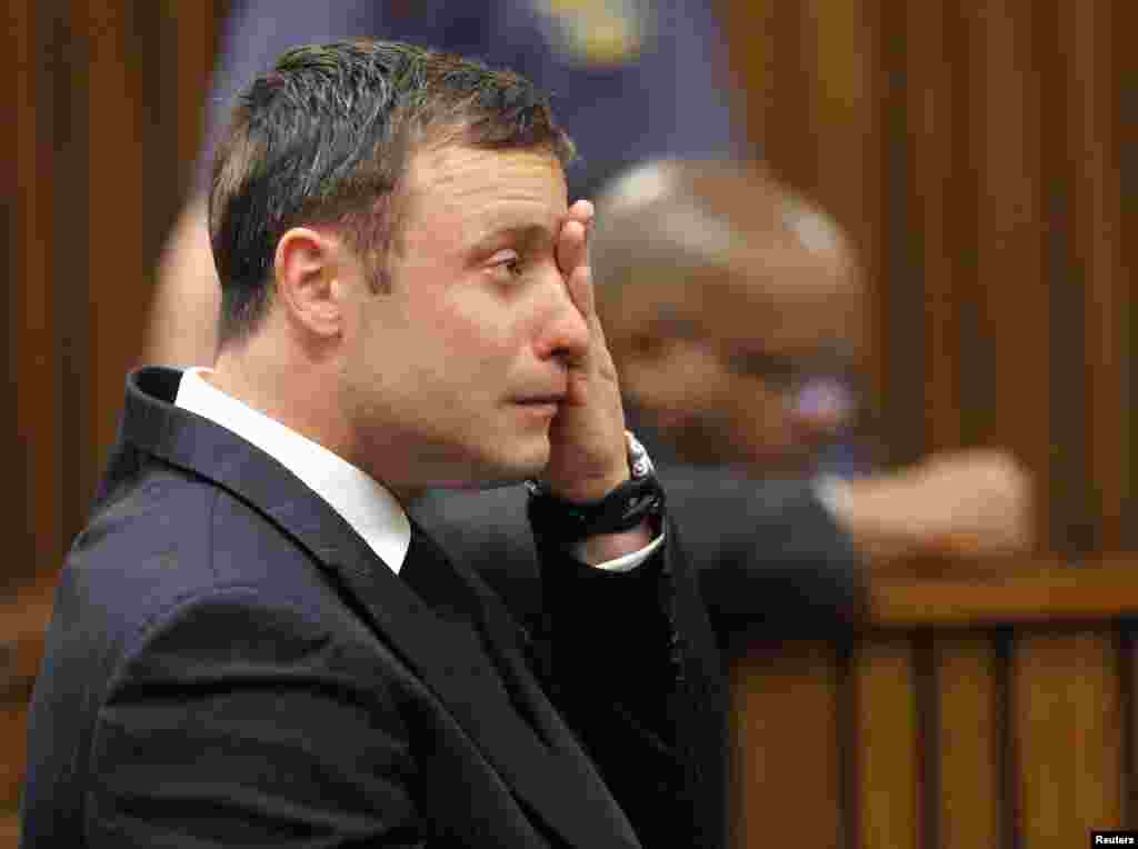 Oscar Pistorius reacts as he listens to Judge Thokozile Masipa&#39;s verdict at the North Gauteng High Court in Pretoria, Sept. 11, 2014.&nbsp;