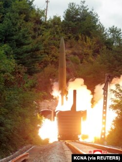 A missile is seen launched during a drill of the Railway Mobile Missile Regiment in North Korea, in this image supplied by North Korea's Korean Central News Agency on September 16, 2021.