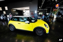 FILE - A 2025 Cooper S hardtop sits on display in the showroom of a Mini dealership in Highlands Ranch, Colorado, Sept. 4, 2024.