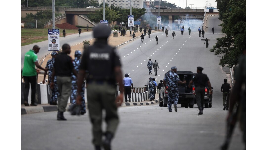 Nigerian police officers patrol in the streets of Abuja during clashes with members of the shiite Islamic Movement of Nigeria on July 22, 2019.