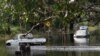 Cars sit in floodwaters in Londonderry, a suburb outside Sydney on March 25, 2021, as flood-stricken residents along Australia's east coast began a massive clean up effort following days of floods. 