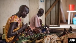 Malnourished children receive treatment at the Leer Hospital, South Sudan, on July 7, 2014. UN humanitarian chief Valerie Amos warned that South Sudan could face famine if seven months of fighting do not end.
