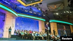 Lucinda Storz of Rutland, Vermont, spells the word "lacustrine" during the third round of the 88th annual Scripps National Spelling Bee at National Harbor, Maryland, May 27, 2015.