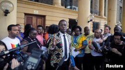 An LGBT activist delivers a statement after a ruling by Kenya's high court to uphold a law banning gay sex, at the Milimani high Court in Nairobi, Kenya, May 24, 2019.