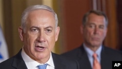 House Speaker John Boehner of Ohio looks on at right as Israeli Prime Minister Benjamin Netanyahu makes a statement on Capitol Hill in Washington, May 24, 2011