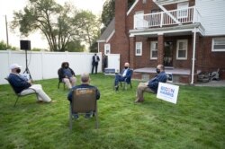 FILE - Democratic presidential candidate former Vice President Joe Biden (C) speaks with steelworkers during a backyard conversation in Detroit, Michigan, Sept. 9, 2020. On Oct. 16, 2020, Biden is due in Southfield and Detroit, Michigan.