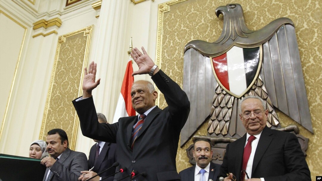 FILE - In this Jan. 10, 2016, photo, Ali Abdel-Al waves after being elected Speaker of Egypt's parliament, in Cairo, Egypt.
