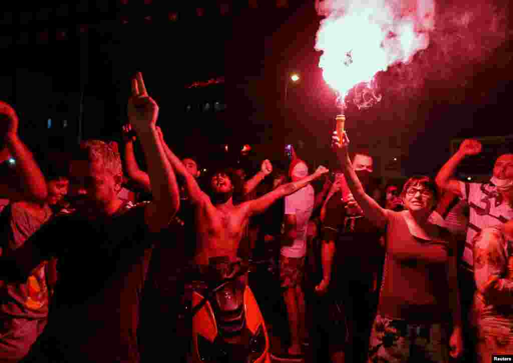 Supporters of Tunisia&#39;s President Kais Saied gather on the streets as they celebrate after he dismissed the government and froze parliament, in Tunis, Tunisia July 25, 2021.