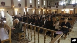 Iraqi Christians attend a mass at St. Joseph's Chaldean Church an Eastern Rite church affiliated with the Roman Catholic Church, in Baghdad, Iraq (File Photo)