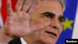 FILE - Austrian Chancellor Werner Faymann addresses a news conference after a cabinet meeting in Vienna, Feb. 16, 2016.