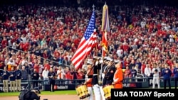  The American flag is presented for the national anthem before Game 4 of the 2019 World Series between the Houston Astros and the Washington Nationals at Nationals Park in Washington, Oct. 26, 2019.