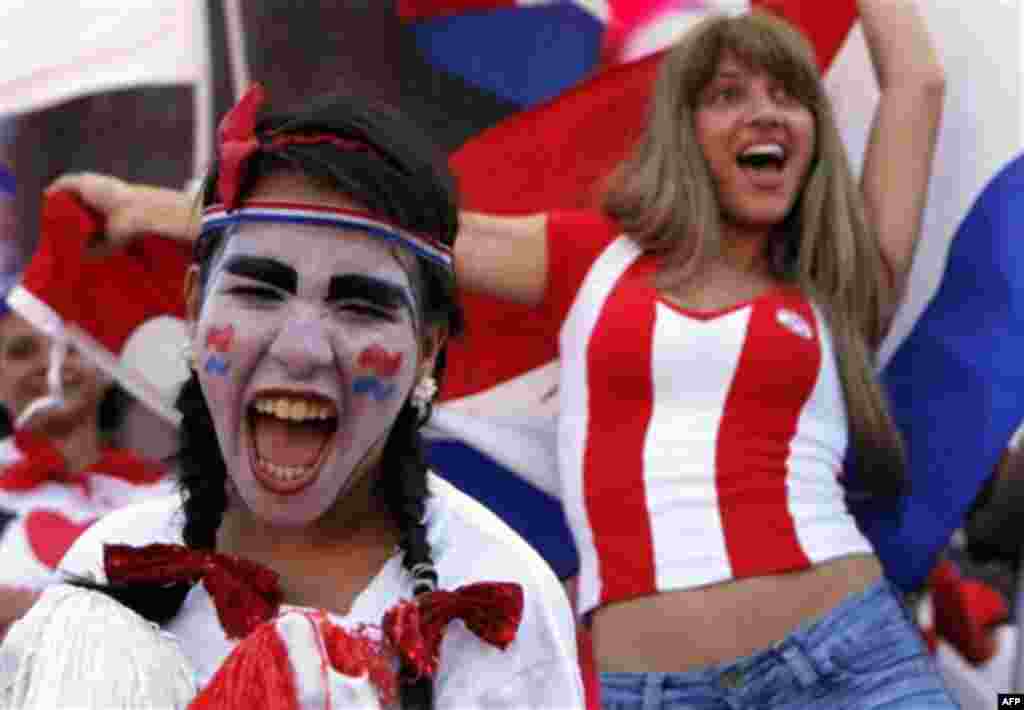 Soccer fans celebrate Paraguay making it to the next round of the South Africa 2010 WCup, after a match against New Zealand, in Asuncion, Thursday, June 24, 2010. Paraguay was held to a 0-0 draw by New Zealand in the match, but still won its World Cup gro