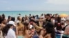 Spring breakers gather in South Beach, Monday, March 14, 2016, at Miami Beach, Fla. College students relax and have fun during their Spring Break. (AP Photo/Alan Diaz)