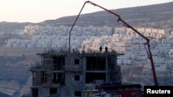 FILE - A construction site is seen in the Israeli settlement of Givat Zeev in the occupied West Bank, Dec. 22, 2016.