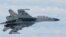 Tư liệu - Một máy bay chiến đấu SU-27 của Trung Quốc bay trên Biển Hoa Đông trong bức hình do Bộ Quốc phòng Nhật Bản công bố, ngày 11 tháng 6, 2014.