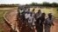 Malian women and men run during a training session at the FLN movement [North Liberation Forces] camp in Sevare, Mali, September 24, 2012.