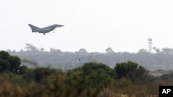 A British Typhoon fighter jet comes in to land at a British air base in Akrotiri, Cyprus, Aug. 29 2013.