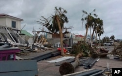 Damaged buildings and fallen trees litter downtown Marigot, on the island of St. Martin, after the passing of Hurricane Irma, Sept. 9, 2017.