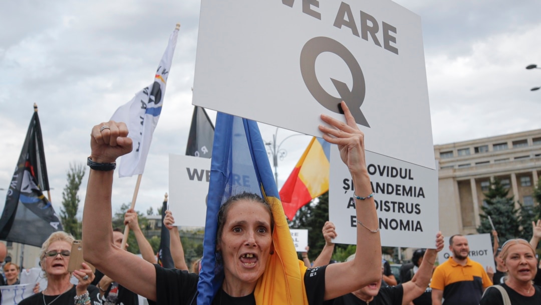 Sledbenici Kjuanona u Rumuniji (Foto: AP/Vadim Ghirda)