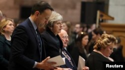 Ireland's Prime Minister (Taoiseach) Leo Varadkar, Britain's Prime Minister Theresa May and Ireland's President Michael D. Higgins attend the funeral service for murdered journalist Lyra McKee at St Anne's Cathedral in Belfast, Northern Ireland, Apr. 24, 