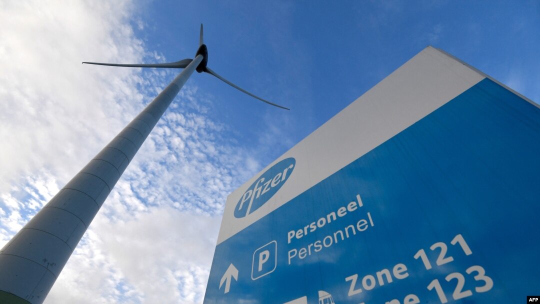 FILE - This picture taken Dec. 22, 2020 shows the logo of Pfizer on the entrance sign of its production site in Purrs, Belgium. 