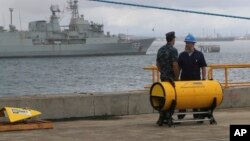 A pinger is being fitted to the Ocean Shield in the search for missing Malaysia Airlines Flight MH370 in Perth, Australia.