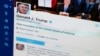 FILE- President Donald Trump's Twitter feed is photographed on a computer screen in Washington. April 3, 2017. 