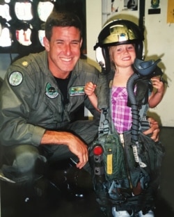 Francesca Browne suits up in the flight gear of her father, Navy fighter pilot Putnam Browne. (Browne family)