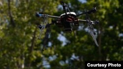 FILE - A Flirtey drones delivers medical supplies in Wise County, Virginia, in the first FAA-approved drone delivery in the U.S. (Flirtey)