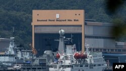 Myanmar vessels UMS Than Lwin (R) and UMS Sin Phyu Shin, which will be used to deport Myanmar migrants from Malaysia back to their homeland, are seen docked at a jetty in Lumut, outside Kuala Lumpur, Feb. 22, 2021. 