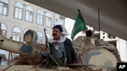 A Houthi Shi'ite fighter guards a street leading to the residence of former President Ali Abdullah Saleh, in Sana'a, Yemen, Dec. 4, 2017.