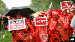 FILE - Demonstrators rally for fair trade at the Capitol in Washington, May 7, 2014