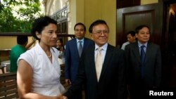 Leader of the Cambodia National Rescue Party (CNRP) Kem Sokha shakes hands with French Ambassador to Cambodia Eva Nguyen Binhin at his home in Phnom Penh, Cambodia, Nov. 11, 2019.