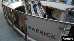 FILE - The logo of sponsor Barrick Gold Corporation is seen as visitors arrive at the Prospectors and Developers Association of Canada (PDAC) annual convention in Toronto, Canada March 4, 2019. 