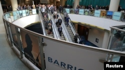 FILE - The logo of sponsor Barrick Gold Corporation is seen as visitors arrive at the Prospectors and Developers Association of Canada (PDAC) annual convention in Toronto, Canada March 4, 2019. 