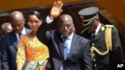 FILE - Congolese President Joseph Kabila, center, waves as he and others celebrate independence for the Democratic Republic of Congo in Kindu, Congo. 