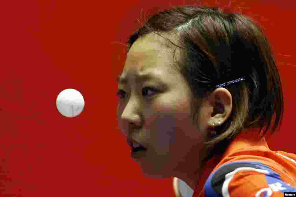 South Korea&#39;s Yang Ha-eun eyes the ball as she serves to Russia&#39;s Olga Baranova during the World Team Table Tennis Championships in Tokyo, Japan.