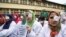 Kashmiri doctors and medical workers wear bandages on their eyes as a mark of protest against the use of pellet guns and recent killings in Srinagar, Indian-controlled Kashmir, Wednesday, Aug. 10, 2016. 
