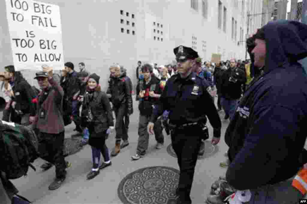 Occupy Wall Street protesters march to a Verizon office to support employees there who are picketing in New York, Tuesday, Oct. 4, 2011. The protests have gathered momentum and gained participants in recent days as news of mass arrests and a coordinated m