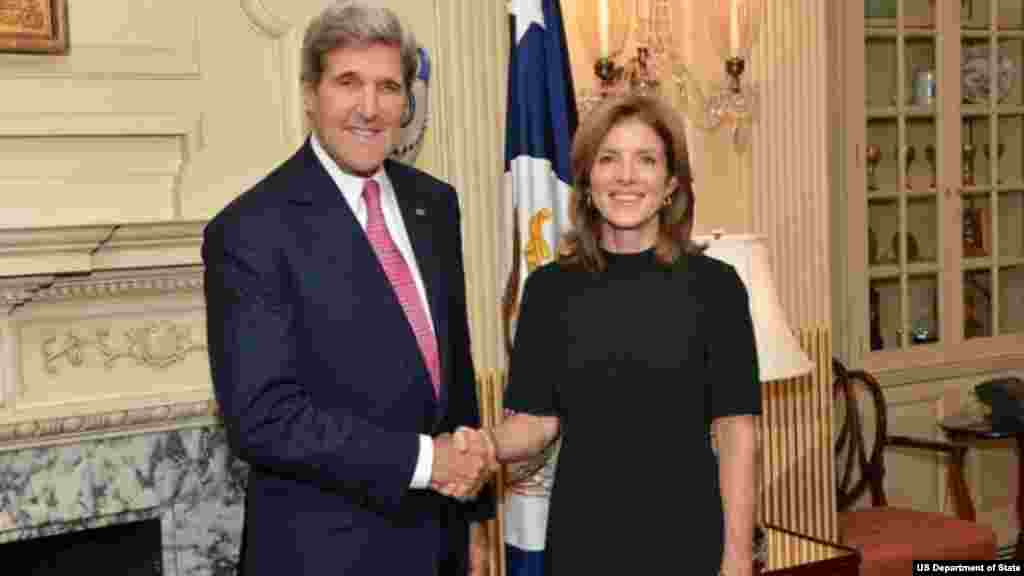 Secretary of State John Kerry and U.S. Ambassador to Japan Caroline Kennedy pose for a photo at Ambassador Kennedy's swearing-in ceremony at the Department of State in Washington, DC, on November 12, 2013.
