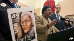 FILE - Assemblywoman Shirley Weber, D-San Diego, center, and state Sen. Scott Wiener called on Gov. Gavin Newsom to posthumously pardon civil rights leader Bayard Rustin, during a news conference in Sacramento.